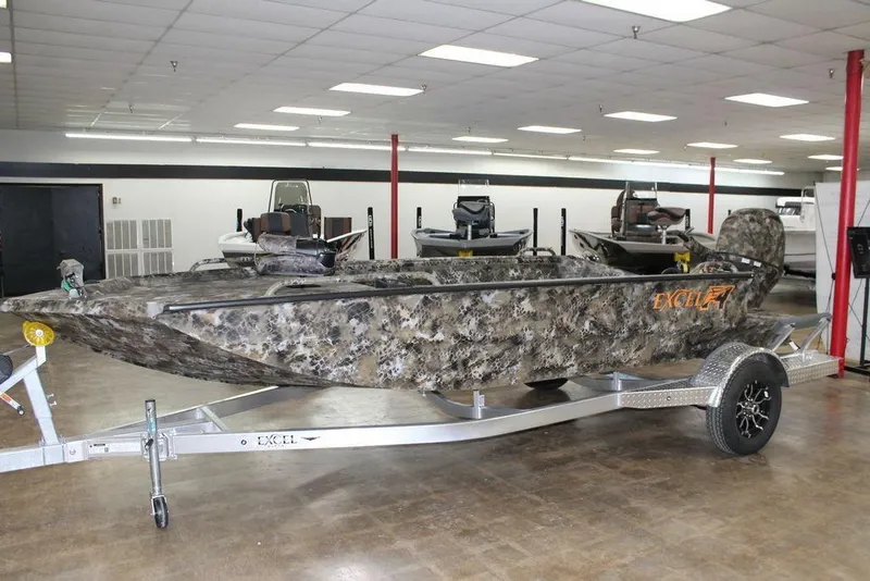 The Image of 2025 Excel Viper F4 1860 boat with camouflage design on a trailer in showroom. - 0