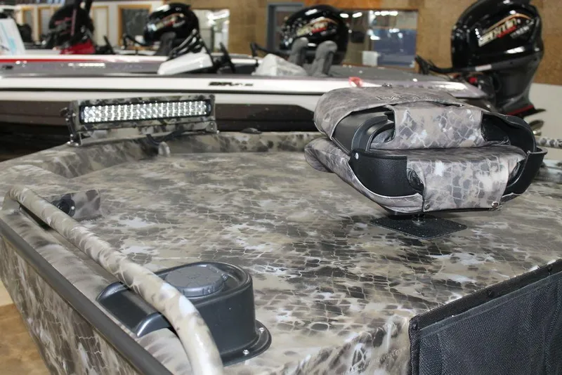 Slide: The Image of 2026 Excel 1860 Viper F4 boat with camouflage design on display indoors. - 4