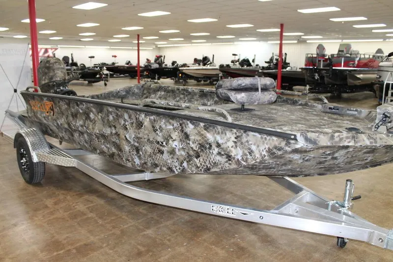Slide: The Image of 2026 Excel 1860 Viper F4 boat with camouflage design on display indoors. - 8