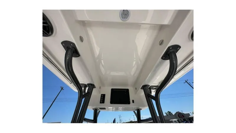 Slide: The Image of 2024 Sea Born FX25 Bay boat interior with sturdy black supports and sleek white ceiling. - 12