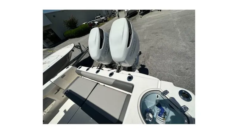 Slide: The Image of 2024 Sea Born FX25 Bay boat with dual engines and seating area. - 14