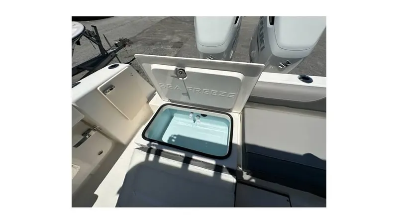 Slide: The Image of 2024 Sea Born FX25 Bay boat with open storage compartment. - 16