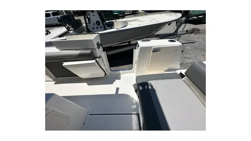 Slide: The Image of 2024 Sea Born FX25 Bay boat interior with seating and storage compartments. - 19
