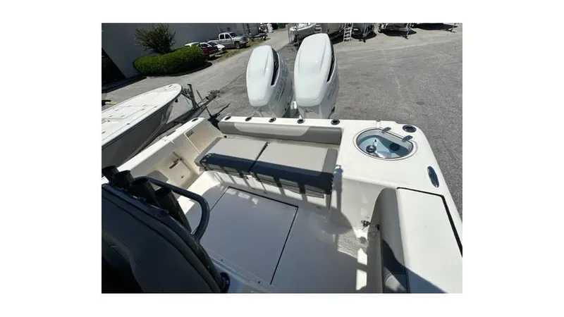 Slide: The Image of 2024 Sea Born FX25 Bay boat interior with seating and storage compartments. - 20