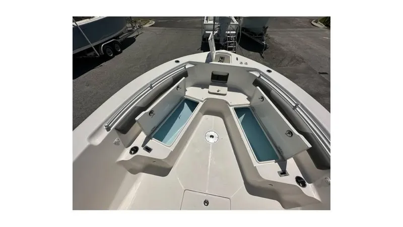 Slide: The Image of 2024 Sea Born FX25 Bay boat interior with storage compartments and seating. - 22