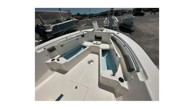 Slide: The Image of 2024 Sea Born FX25 Bay boat interior with storage compartments and seating. - 23