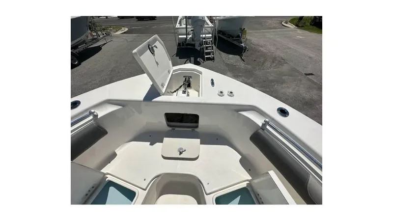 Slide: The Image of 2024 Sea Born FX25 Bay boat interior, featuring open storage compartments and sleek design. - 24