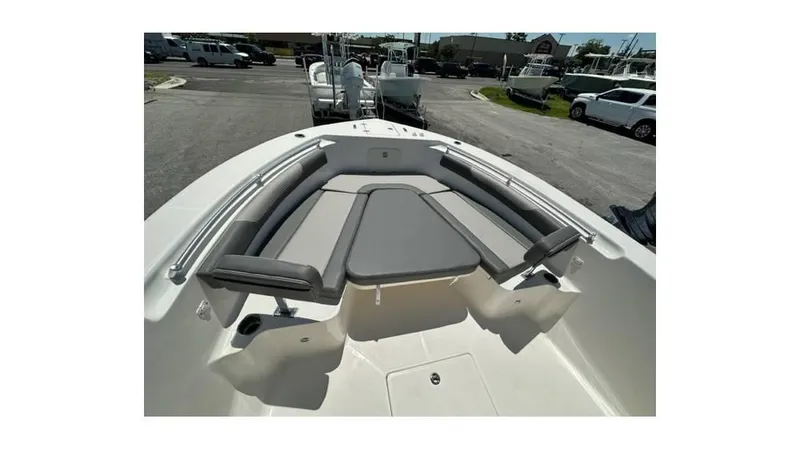 Slide: The Image of 2024 Sea Born FX25 Bay boat interior with cushioned seating and storage compartments. - 28