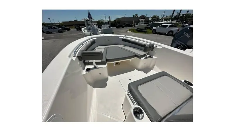 Slide: The Image of 2024 Sea Born FX25 Bay boat interior with cushioned seating and storage compartments. - 29
