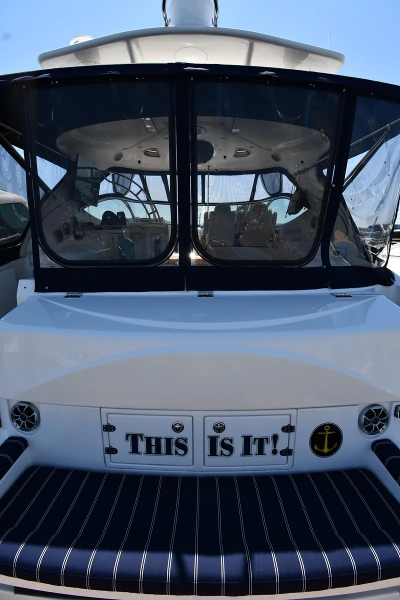 Slide: The Image of 2005 Cruisers Yachts 520 Express with This Is It! sign on the stern. - 10