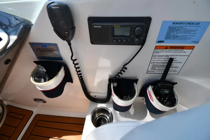 Slide: The Image of Control panel of 2005 Cruisers Yachts 520 Express with radio and communication devices. - 19