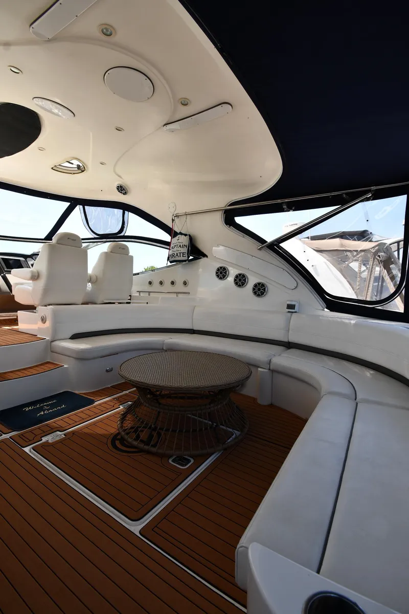 Slide: The Image of 2005 Cruisers Yachts 520 Express interior with seating and table. - 23