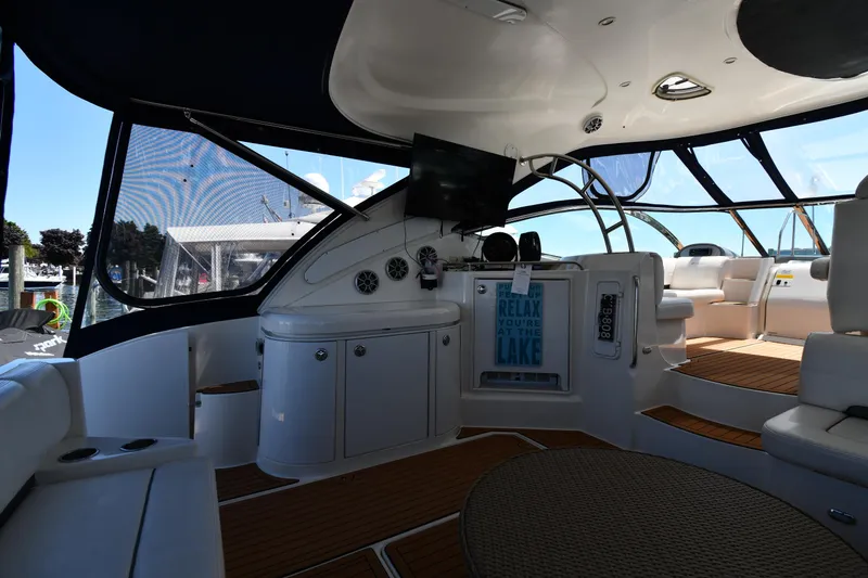 Slide: The Image of 2005 Cruisers Yachts 520 Express interior with seating and entertainment area. - 24