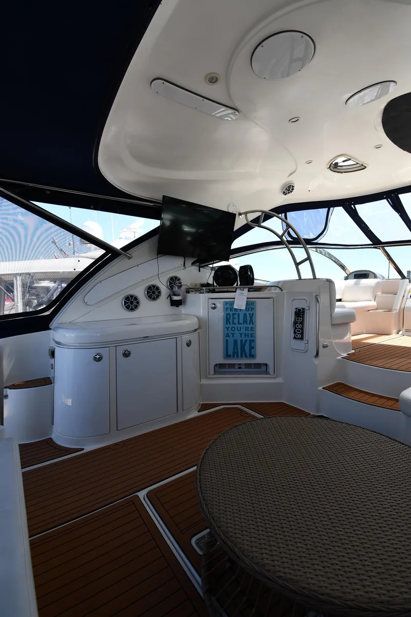 Slide: The Image of Interior of 2005 Cruisers Yachts 520 Express with modern helm and seating area. - 25