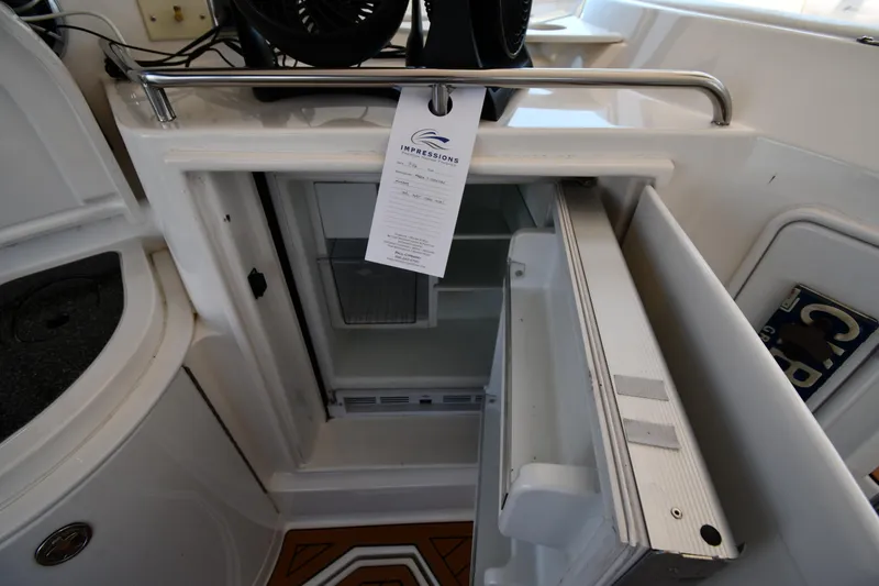Slide: The Image of Open refrigerator on 2005 Cruisers Yachts 520 Express boat. - 29