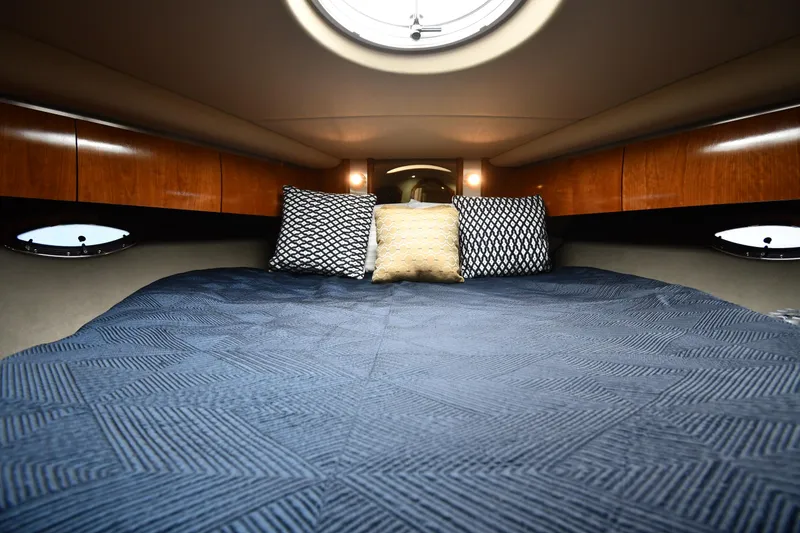 Slide: The Image of Luxurious cabin interior of 2005 Cruisers Yachts 520 Express with cozy bedding. - 33