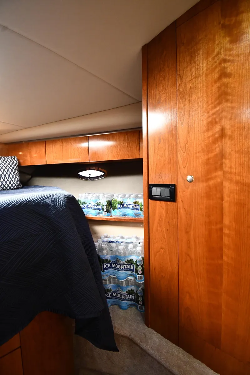 Slide: The Image of Interior cabin of a 2005 Cruisers Yachts 520 Express with wooden cabinetry. - 34