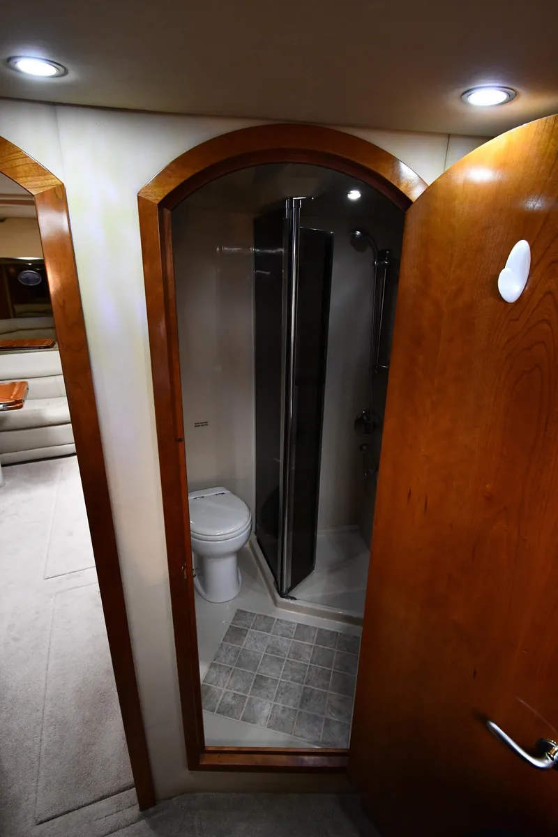 Slide: The Image of 2005 Cruisers Yachts 520 Express bathroom with shower and toilet. - 38