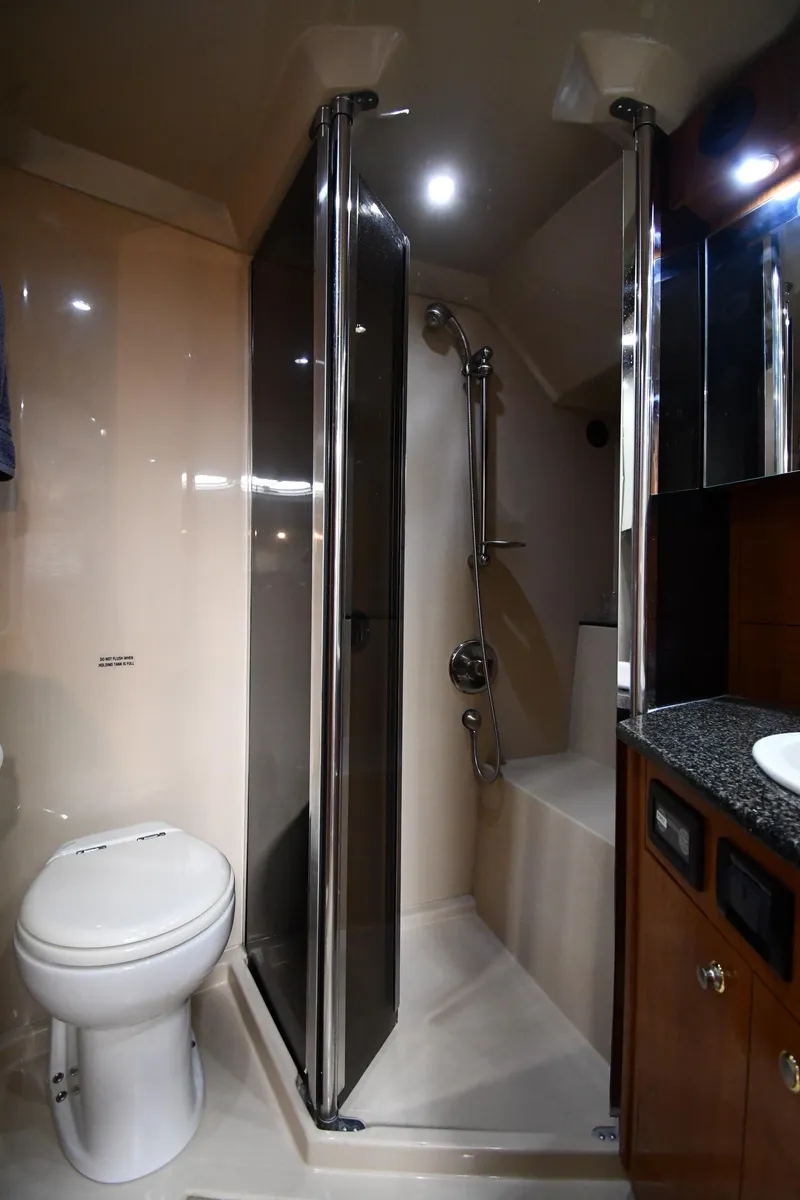 Slide: The Image of 2005 Cruisers Yachts 520 Express bathroom with shower and toilet. - 40