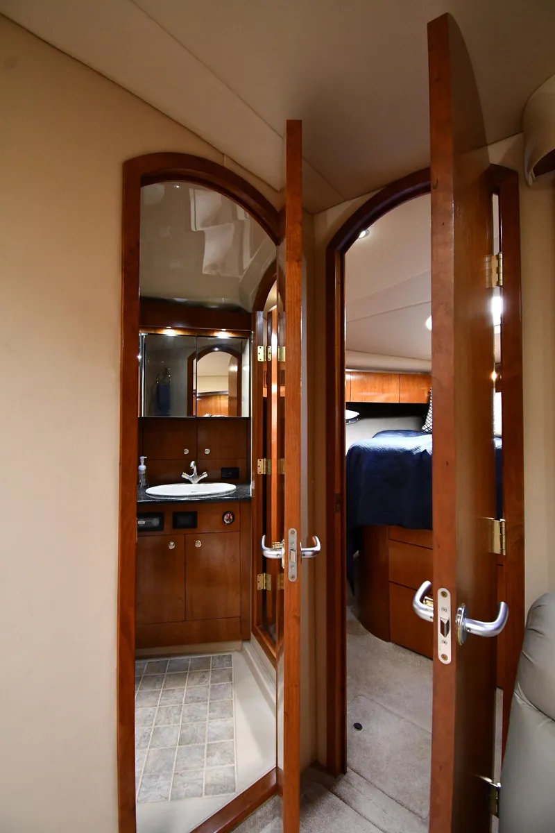 Slide: The Image of 2005 Cruisers Yachts 520 Express interior with bathroom and bedroom view. - 41