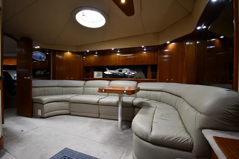 Slide: The Image of Luxurious interior of 2005 Cruisers Yachts 520 Express with leather seating and wooden accents. - 42