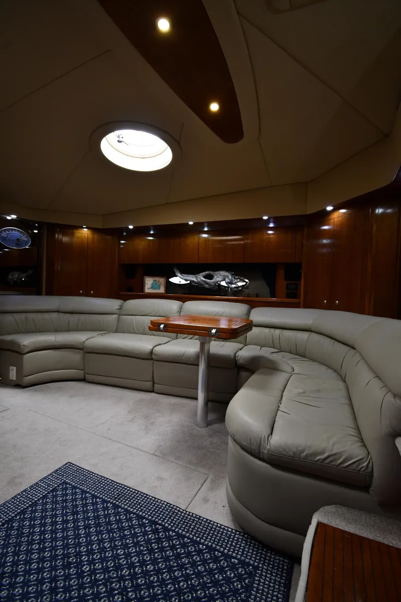Slide: The Image of Luxurious interior of 2005 Cruisers Yachts 520 Express with plush seating and elegant wood finishes. - 43