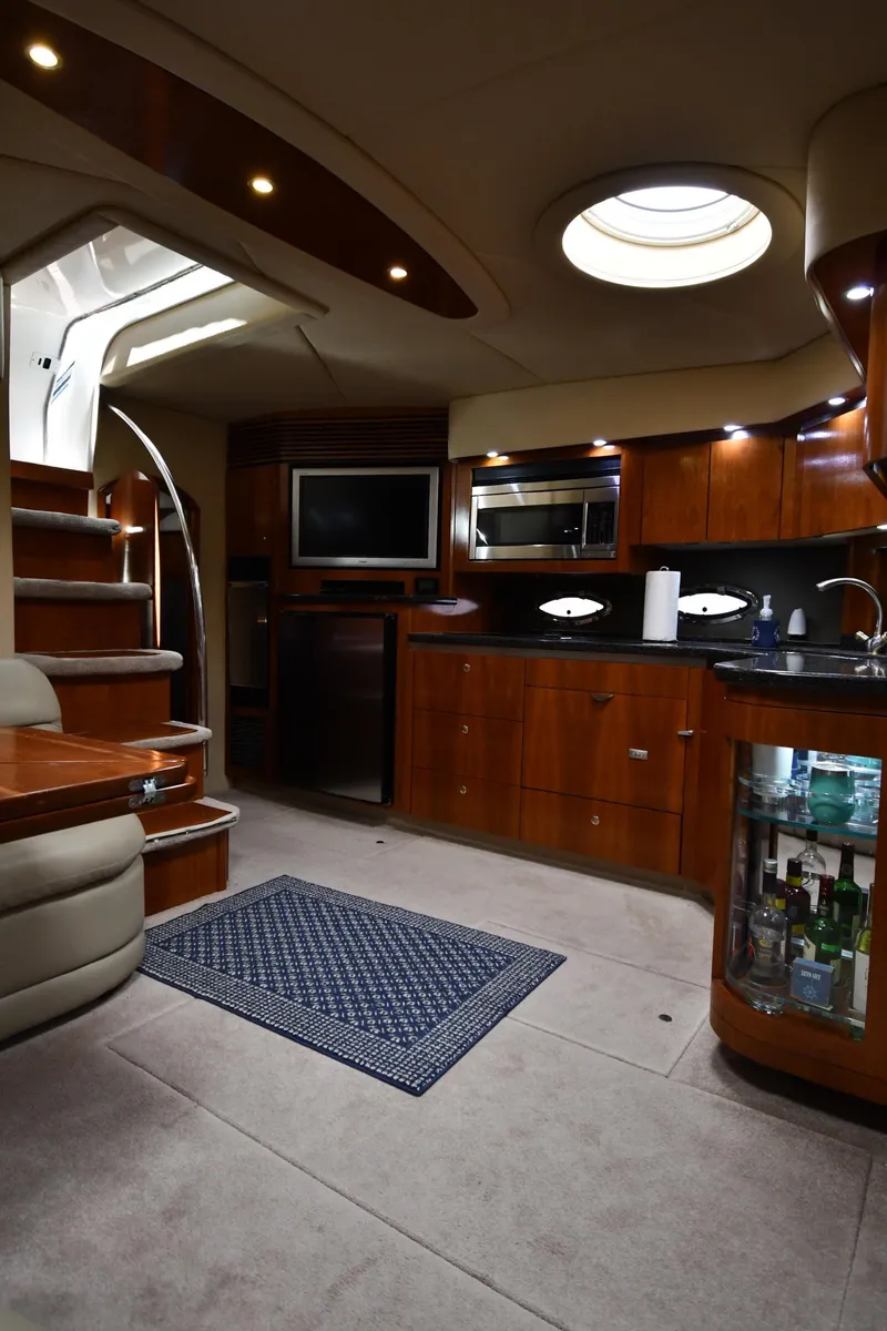 Slide: The Image of Luxurious interior of a 2005 Cruisers Yachts 520 Express with modern amenities. - 46