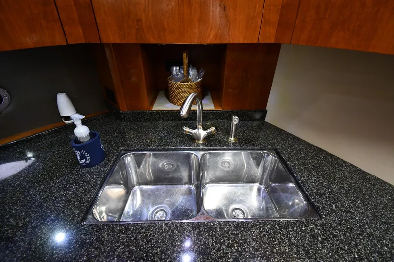 Slide: The Image of 2005 Cruisers Yachts 520 Express kitchen sink with granite countertop - 47