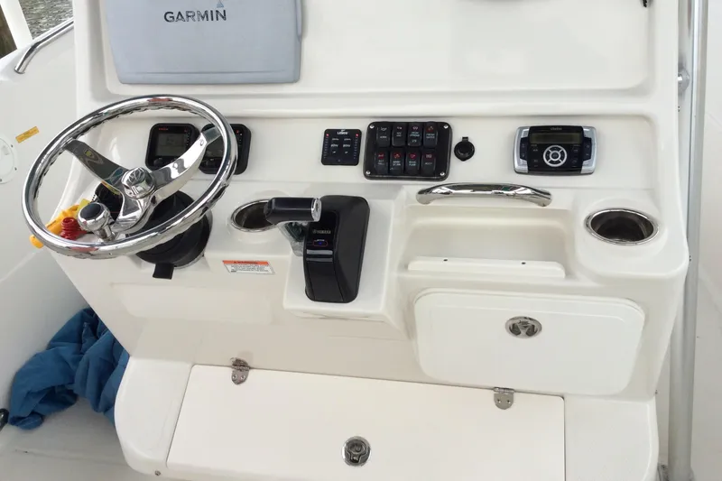 Slide: The Image of 2011 Sailfish Center Console boat dashboard with Garmin navigation and control panel. - 4