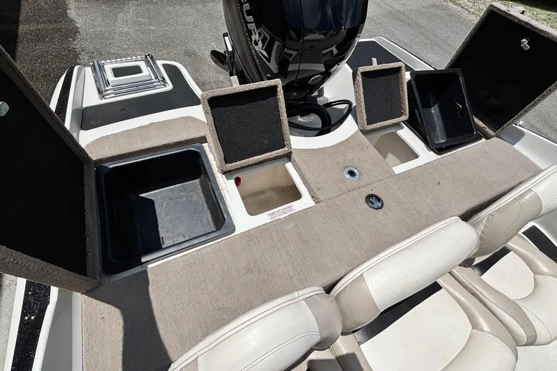 Slide: The Image of 2013 Nitro Z7 Sport boat with open storage compartments and seating. - 12