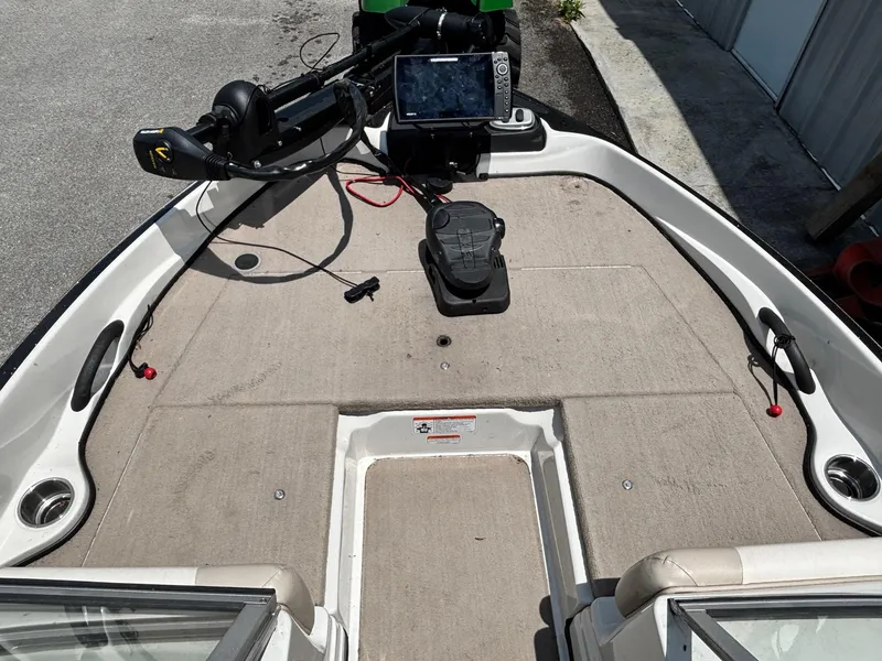 Slide: The Image of 2013 Nitro Z7 Sport boat deck with steering controls and navigation equipment. - 3