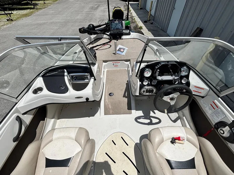 Slide: The Image of 2013 Nitro Z7 Sport boat interior with steering wheel, seats, and dashboard controls. - 7