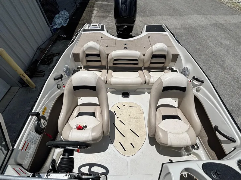Slide: The Image of 2013 Nitro Z7 Sport boat interior with beige seating and steering wheel. - 9