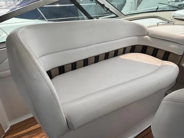 Slide: The Image of 2007 Four Winns 378 Vista boat interior with white cushioned seating. - 10