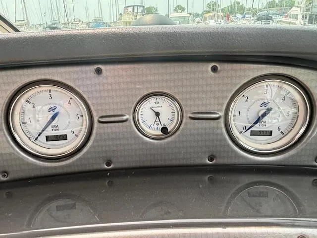Slide: The Image of Dashboard of a 2007 Four Winns 378 Vista boat with gauges. - 11