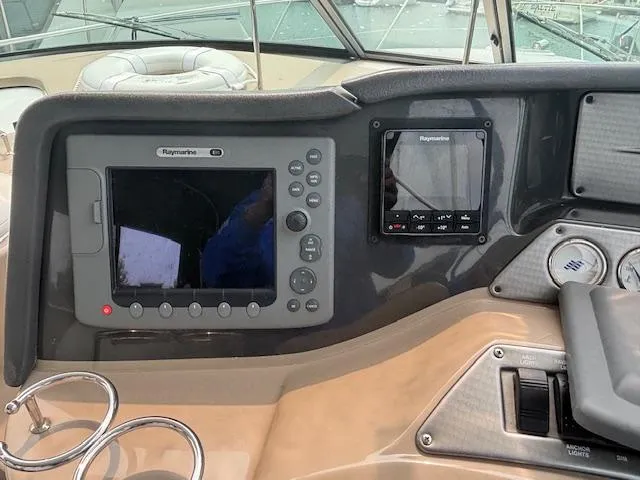 Slide: The Image of 2007 Four Winns 378 Vista boat dashboard with Raymarine navigation equipment. - 12