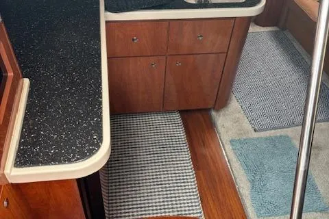 Slide: The Image of 2007 Four Winns 378 Vista interior with wood flooring and modern cabinetry. - 16