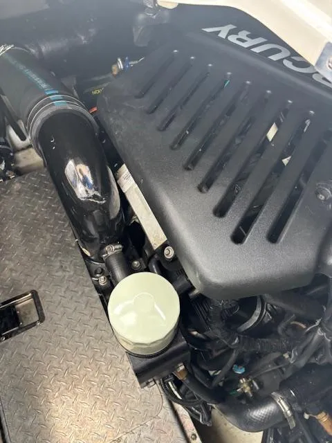 Slide: The Image of Engine compartment of a 2007 Four Winns 378 Vista boat, featuring a Mercury engine. - 21