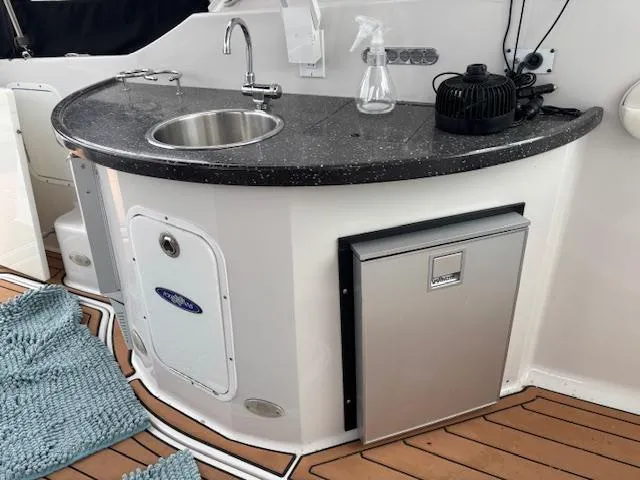 Slide: The Image of Luxurious interior of 2007 Four Winns 378 Vista with leather sofa and decorative pillows. - 3