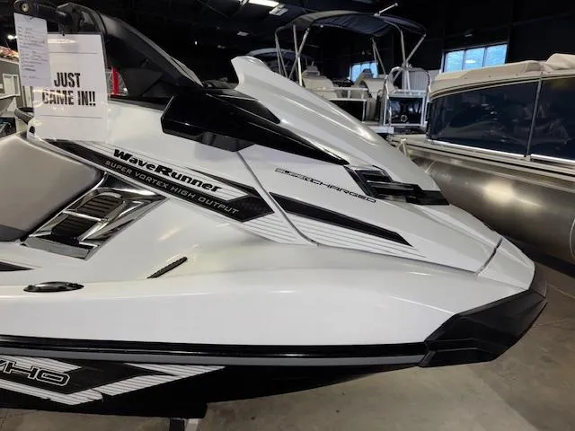 Slide: The Image of 2016 Yamaha WaveRunner FX Cruiser SVHO in showroom, sleek white design. - 9