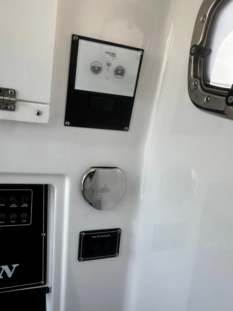 Slide: The Image of Control panel and outlet on 2025 Blackfin 272CC boat interior. - 10