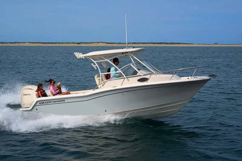 The Image of 2026 Grady-White 218 boat cruising on open water with passengers onboard. - 1