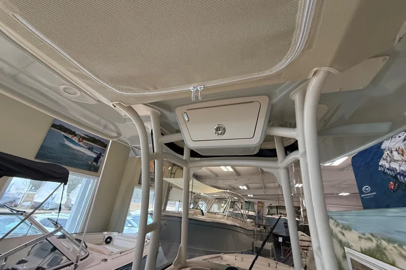 Slide: The Image of 2026 Grady-White Fisherman 216 boat interior, showcasing sturdy framework and storage compartment. - 14