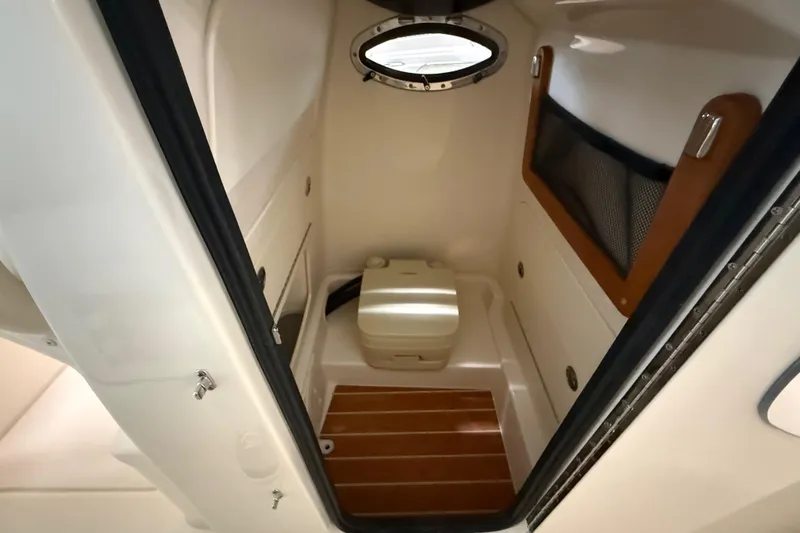 Slide: The Image of 2026 Grady-White Fisherman 216 boat interior with compact marine toilet. - 19
