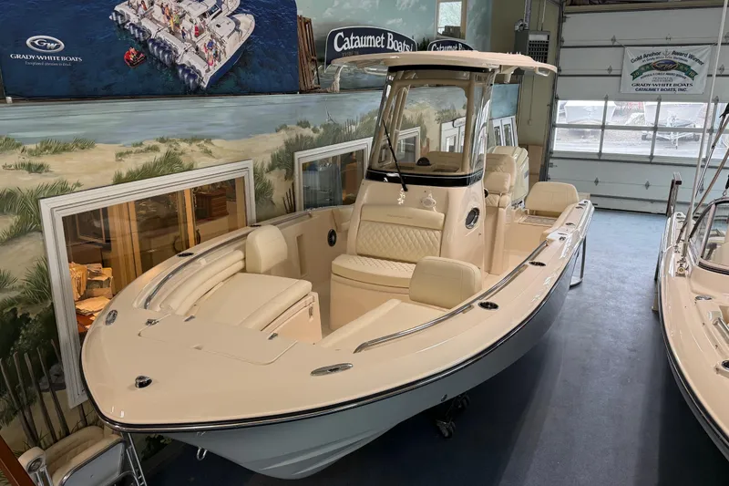 The Image of 2026 Grady-White Fisherman 216 boat displayed in showroom setting. - 2