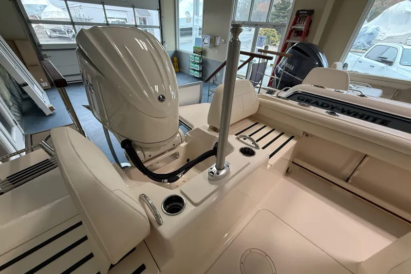 Slide: The Image of 2026 Grady-White Fisherman 216 boat interior with engine and seating area. - 20