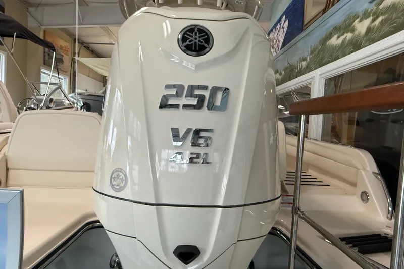 Slide: The Image of 2026 Grady-White Fisherman 216 with 250 V6 4.2L engine in showroom. - 7