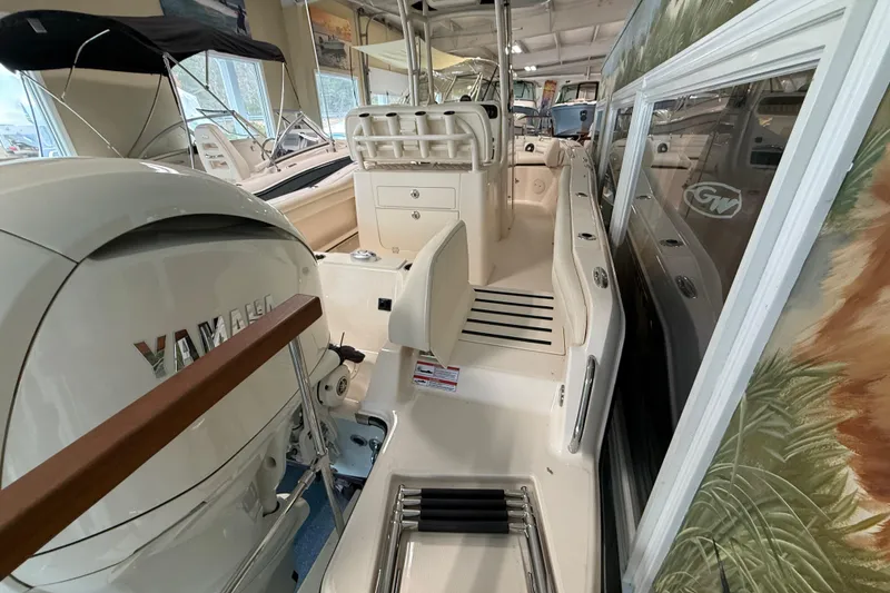 Slide: The Image of 2026 Grady-White Fisherman 216 boat interior with Yamaha engine in showroom. - 8