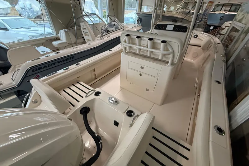 Slide: The Image of 2026 Grady-White Fisherman 216 boat interior, showcasing seating and console features. - 9