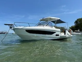 The Image of 2023 Beneteau Flyer 9 SUNdeck boat on clear water under blue sky. - 0